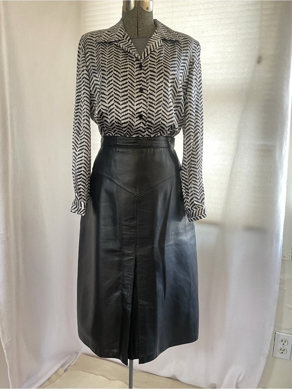 Vintage Nurse Furs black leather midi skirt with V-yoke, made in England